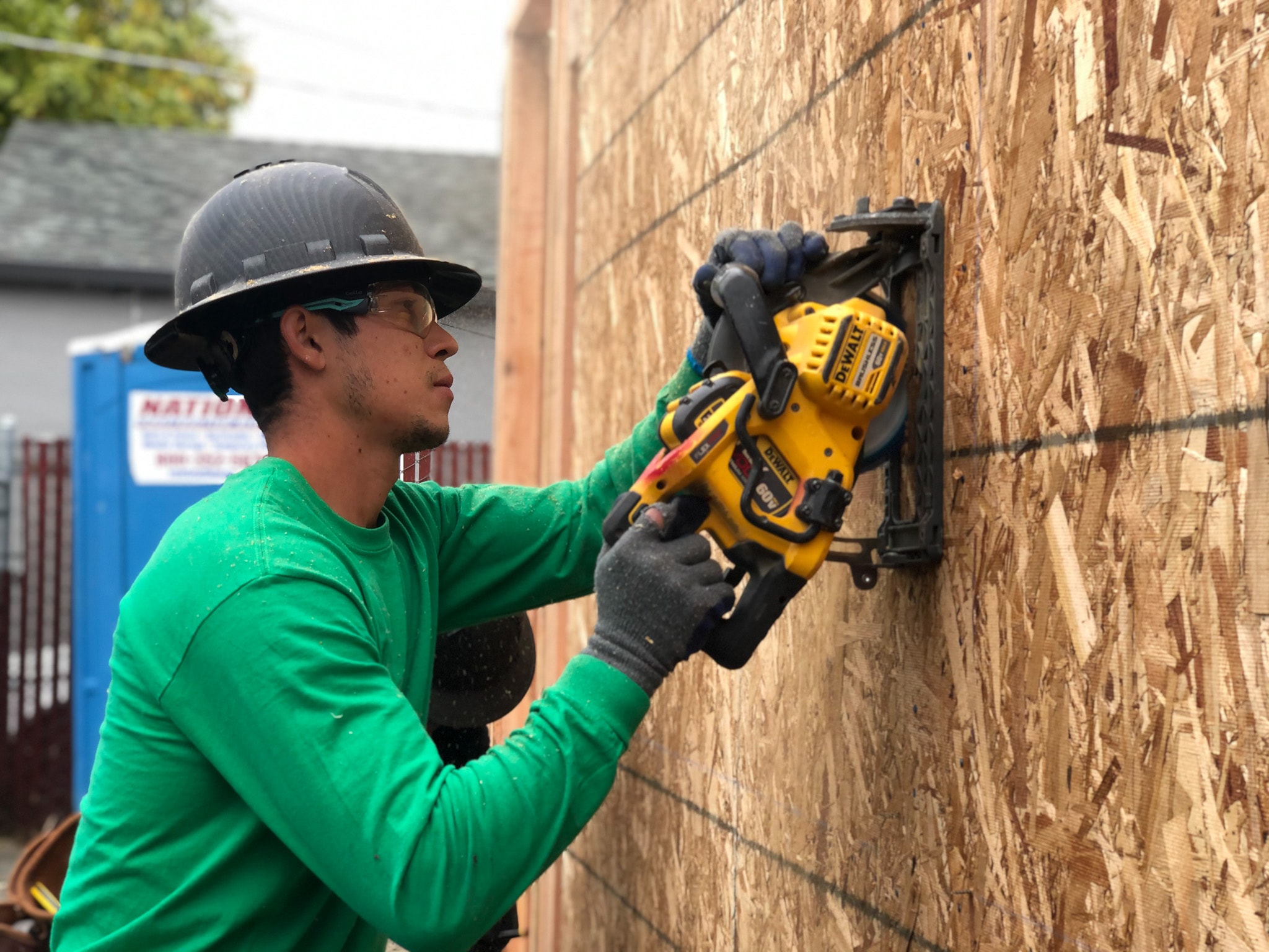 Crew member drilling with DeWalt