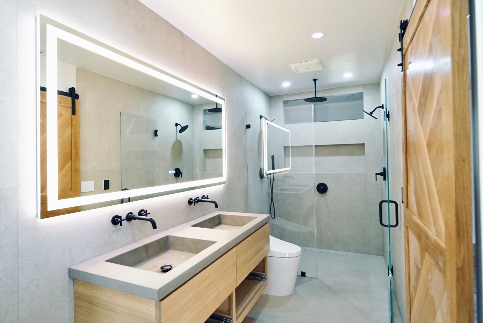 Modern bathroom with dual sinks and barn door