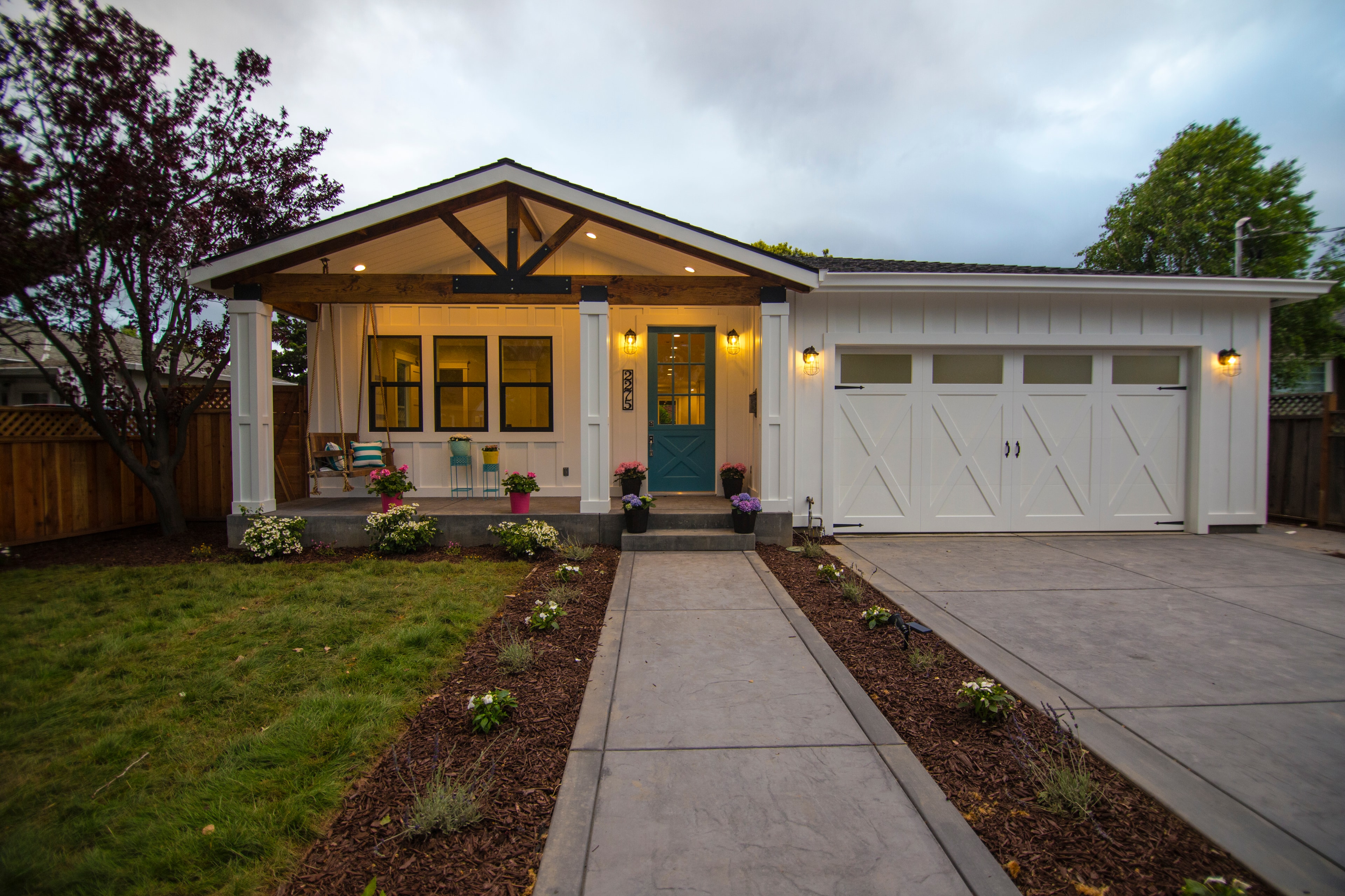 Custom farmhouse exterior at dusk