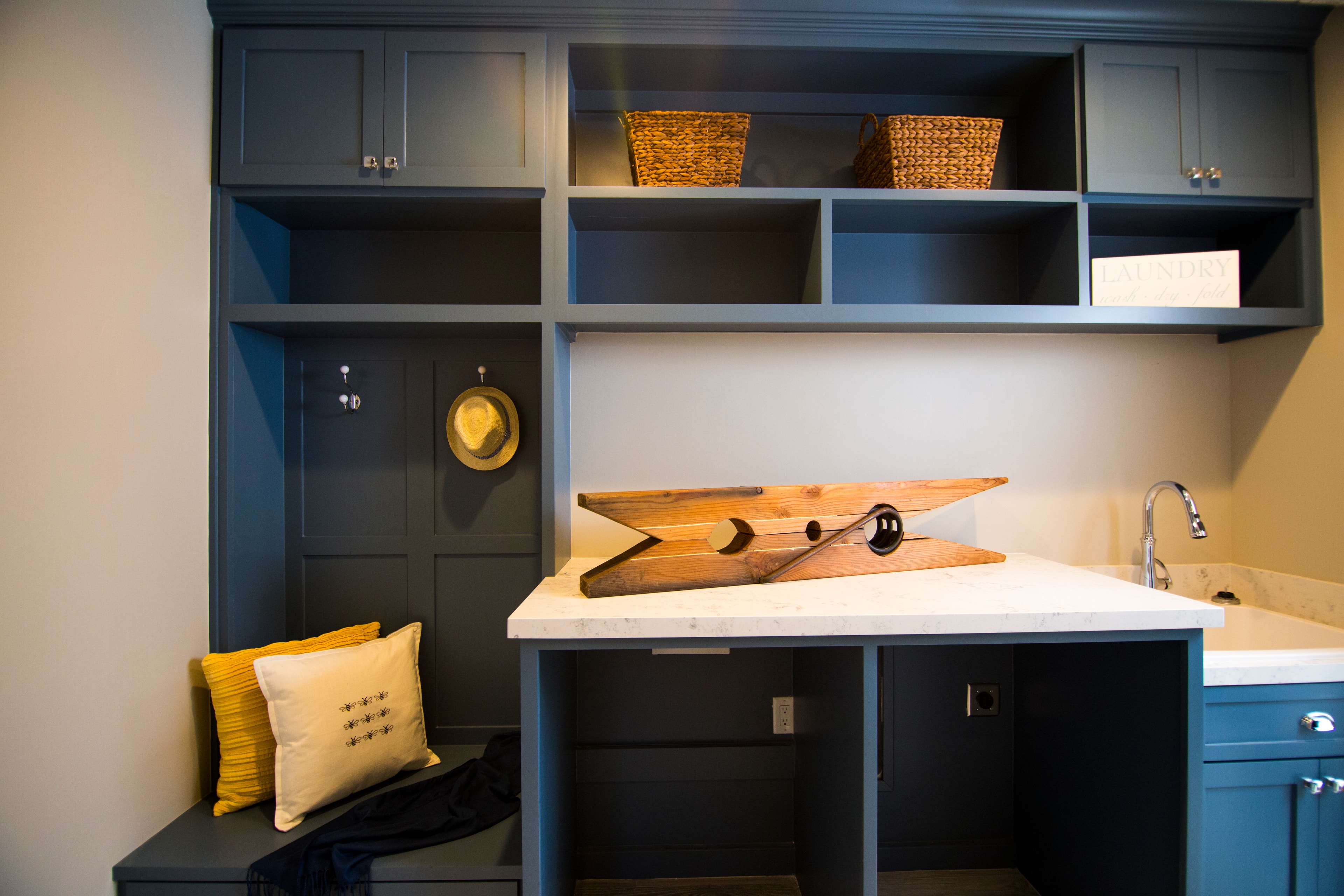 Blue laundry room cabinetry