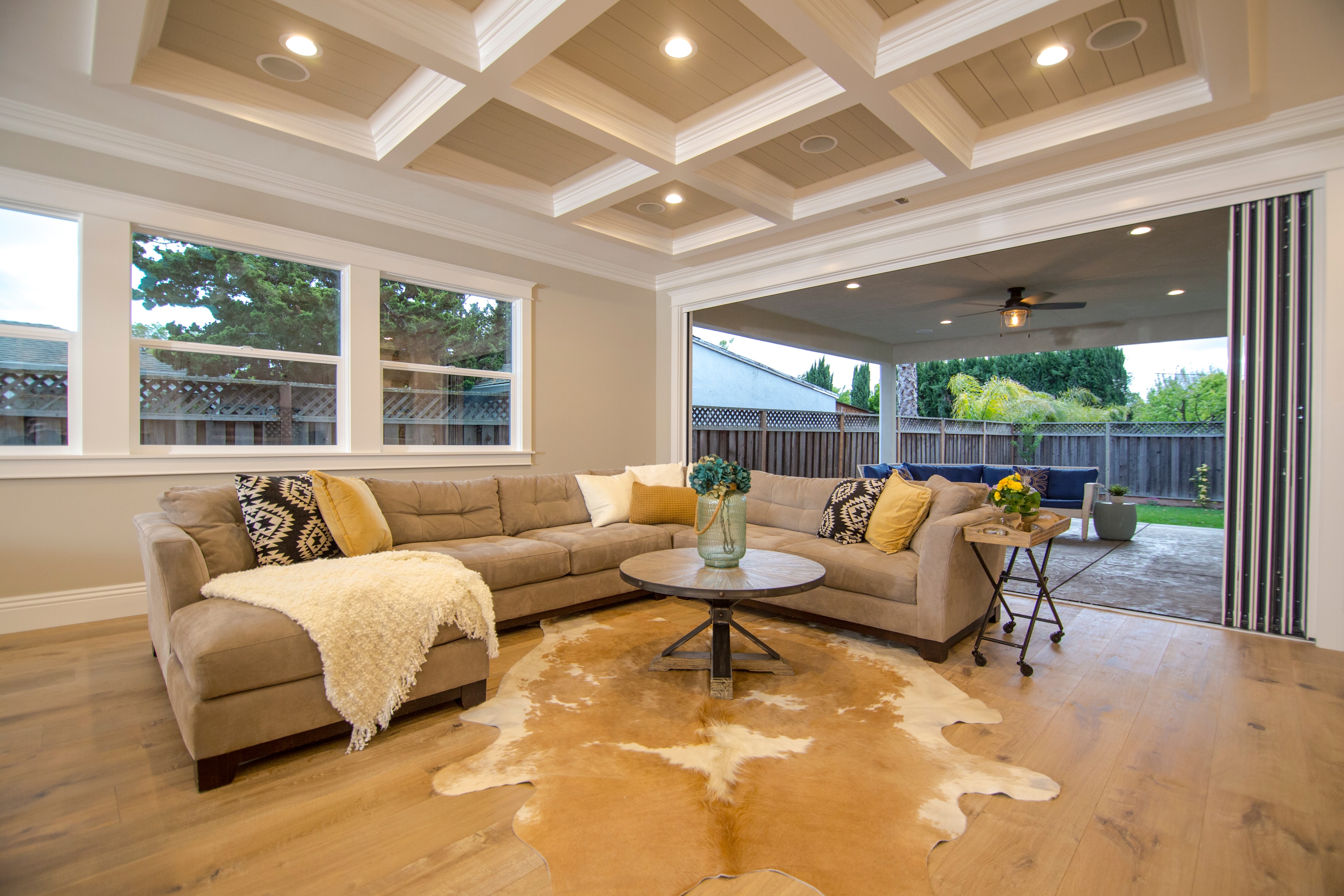 Coffered ceiling living room with outdoor view