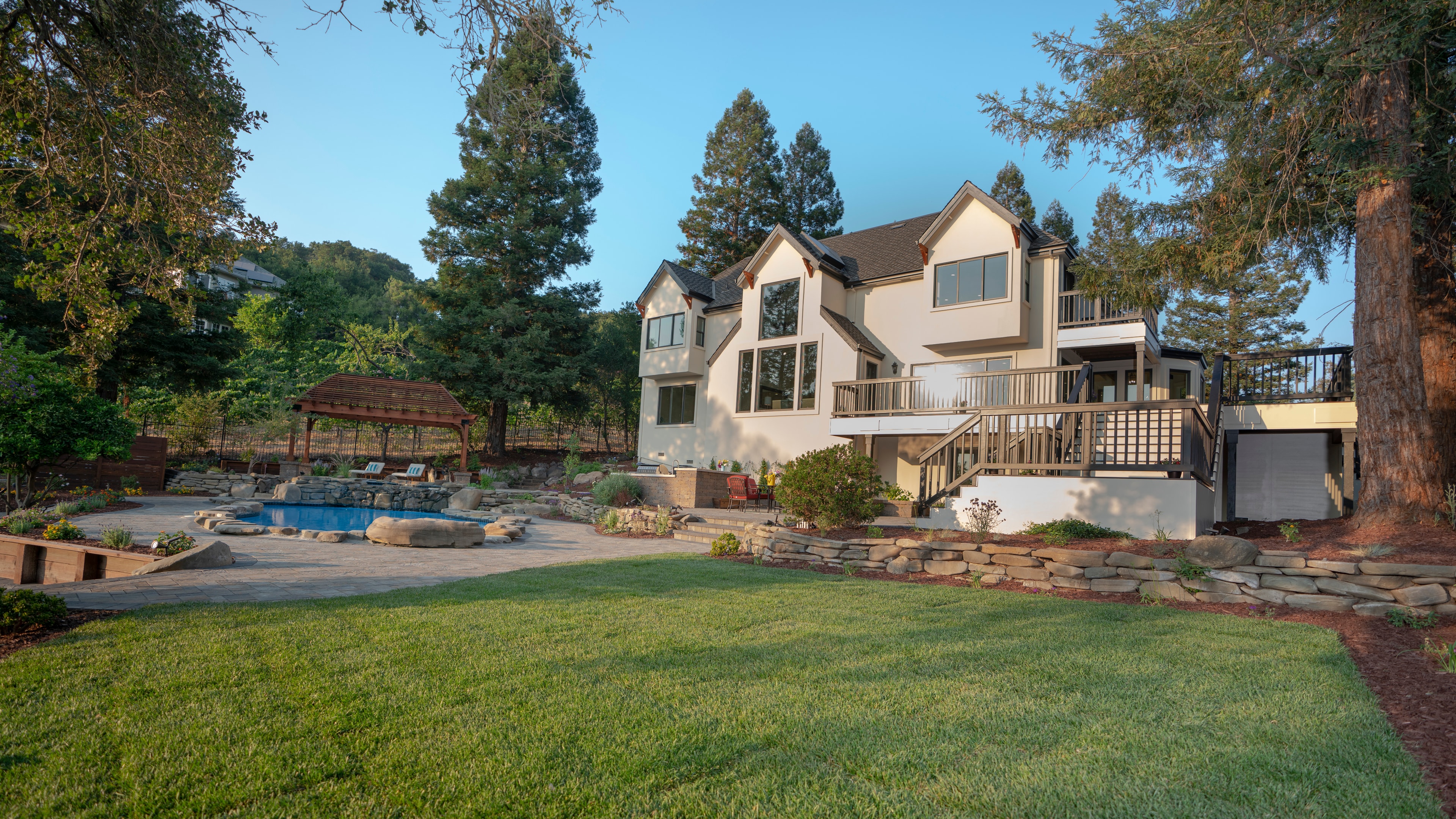 Custom home with pool at golden hour